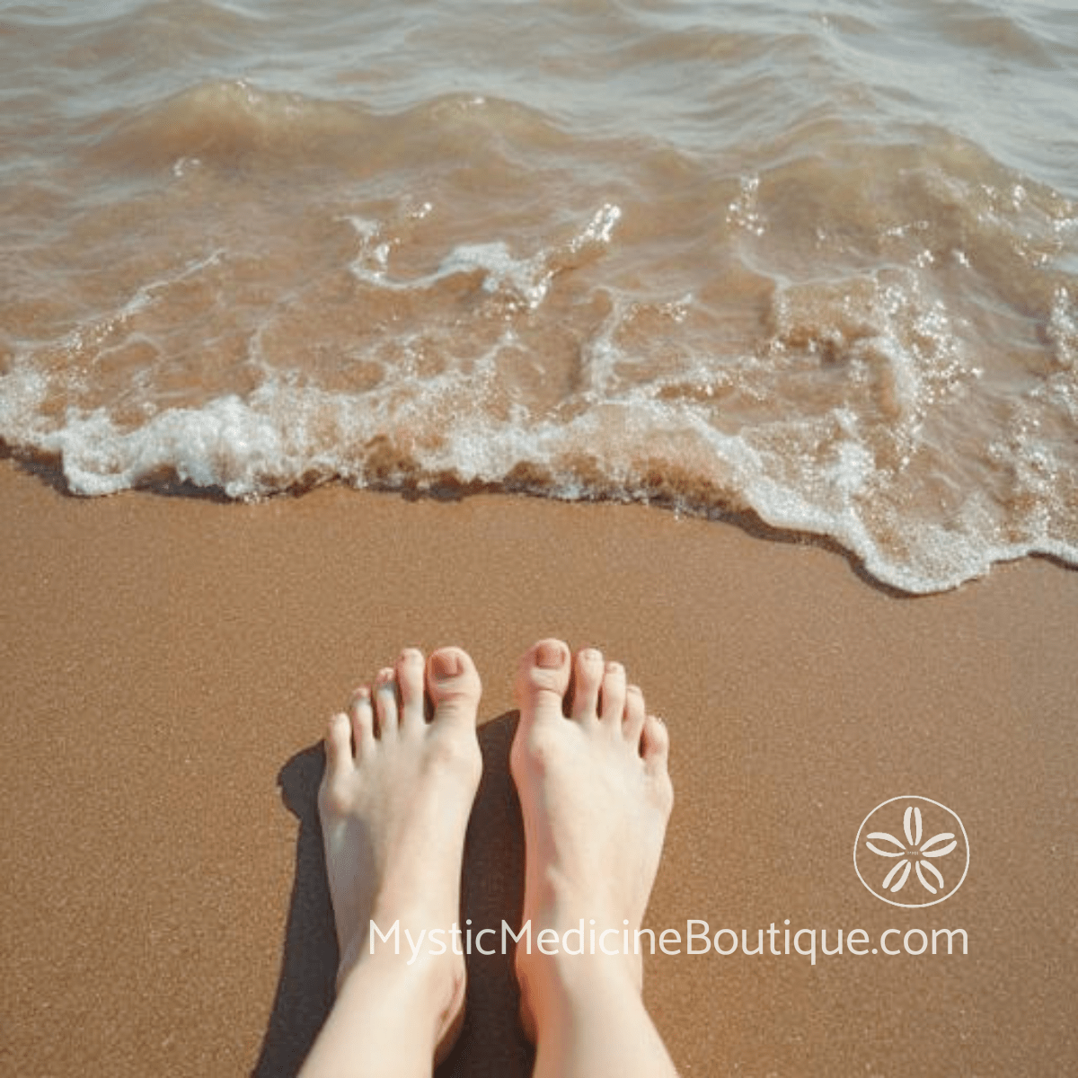 Bare feet on warm sand at the water's edge with gentle waves — daily maintenance practices for balanced kundalini awakening