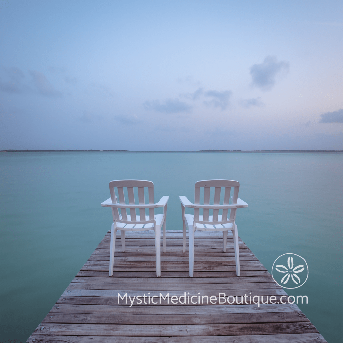 Two empty chairs side by side on a weathered tropical dock over still turquoise water at dusk — how to help someone through kundalini awakening