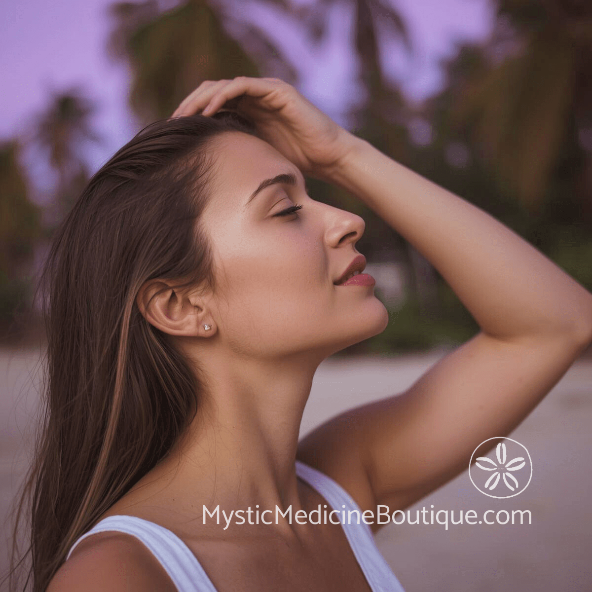Woman with hand raised to her head and eyes closed representing the physical and emotional signs of crown chakra imbalance needing divine connection support