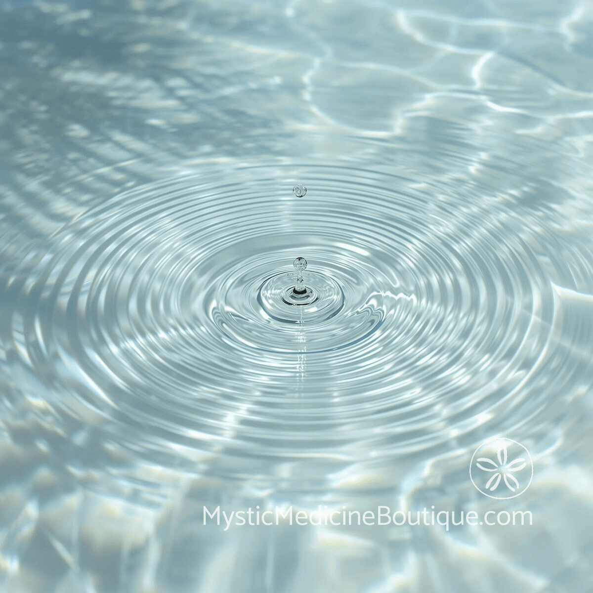 Water droplet creating circular ripples representing the vibrational waves of sound clearing and how frequency moves through and releases absorbed energy