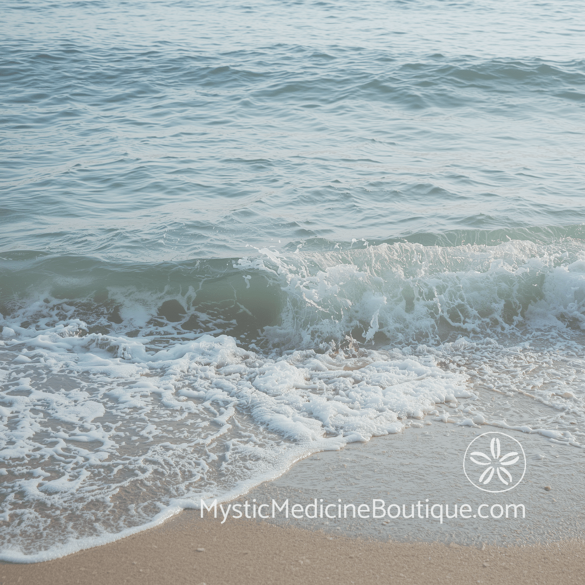 Soft ocean wave meeting a sandy tropical shoreline in calm teal water and pale morning light, representing the distinction between empath sensitivity and normal emotional sensitivity